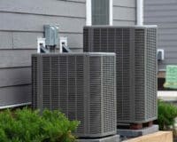 Central Air Conditioning System Replacement | HVAC System units outside of house | Greenwood Plumbing & Heating Air Conditioning & HVAC